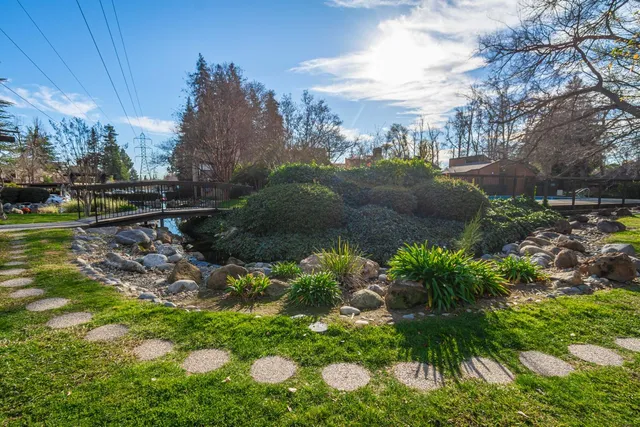 a view of a swimming pool with an outdoor seating