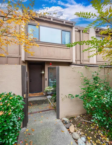 a view of a livingroom with furniture a ceiling fan and wooden floor