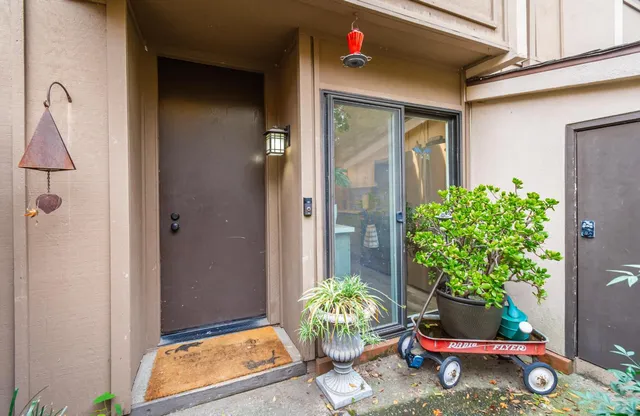 a kitchen that has a lot of cabinets a sink and appliances in it