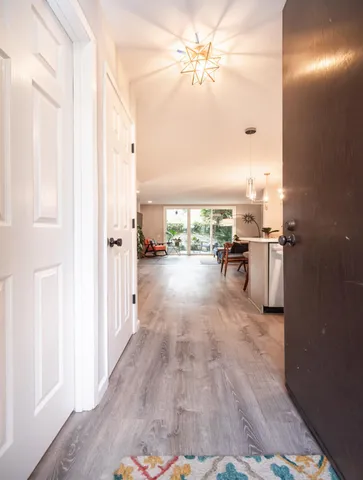 a kitchen with stainless steel appliances a stove refrigerator sink and microwave