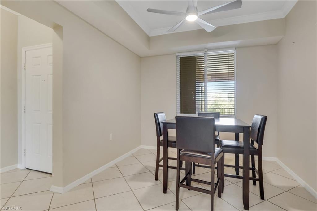 8570 Kingbird Loop, Unit 542 Estero, FL 33967 - Photo 16 of 43 a view of a dining room with furniture and window