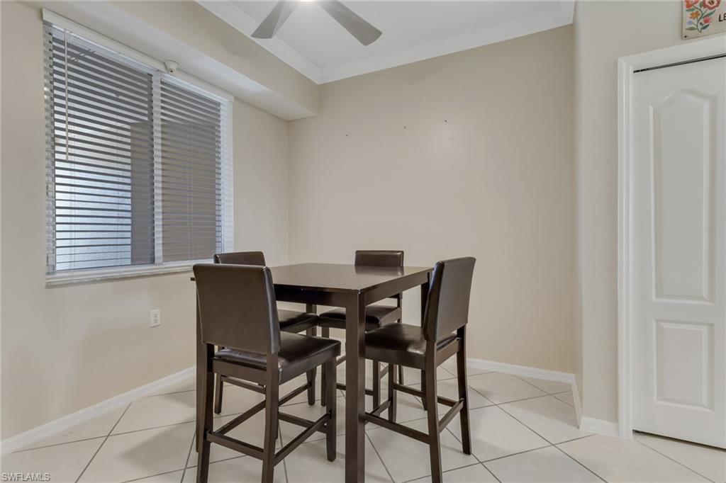 8570 Kingbird Loop, Unit 542 Estero, FL 33967 - Photo 17 of 43 a view of a dining room with furniture and window
