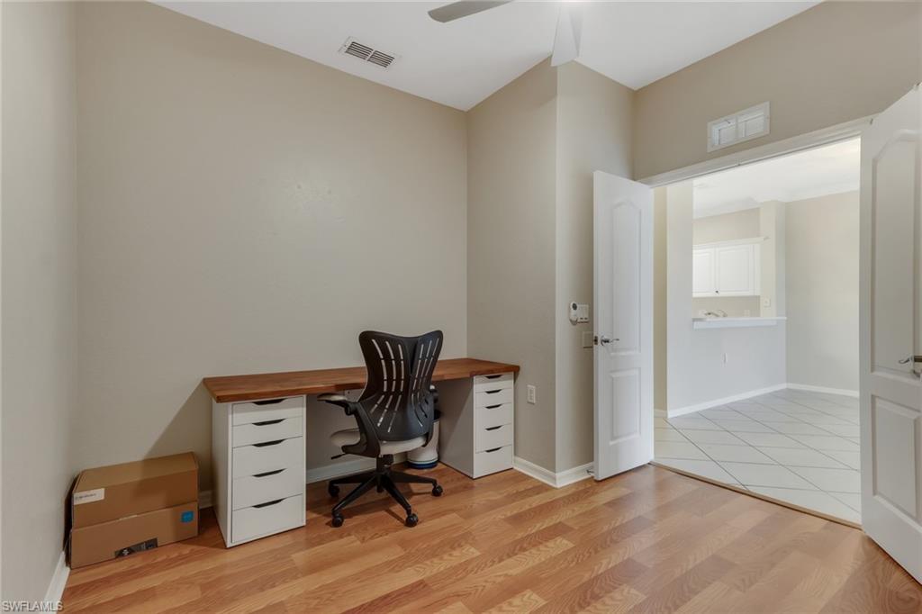 8570 Kingbird Loop, Unit 542 Estero, FL 33967 - Photo 24 of 43 a view of workspace with wooden floor and windows