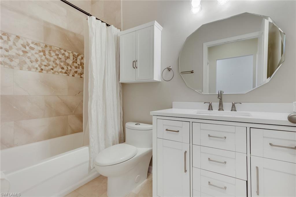 8570 Kingbird Loop, Unit 542 Estero, FL 33967 - Photo 27 of 43 a bathroom with a sink toilet and shower