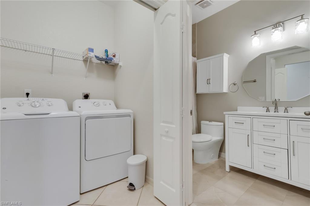 8570 Kingbird Loop, Unit 542 Estero, FL 33967 - Photo 28 of 43 a view of bathroom with a toilet sink and mirror