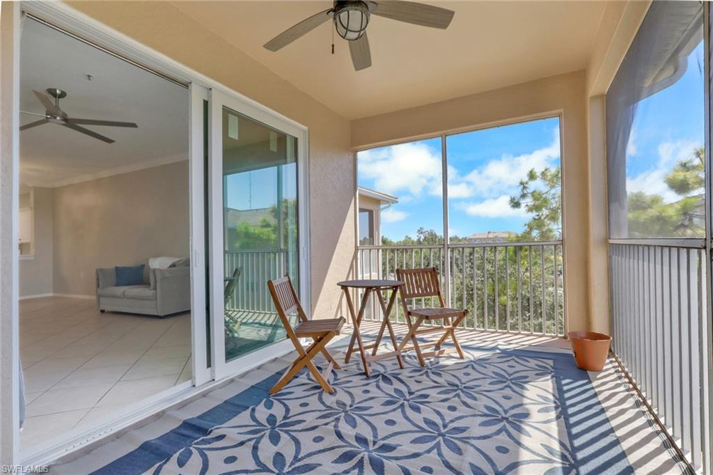 8570 Kingbird Loop, Unit 542 Estero, FL 33967 - Photo 29 of 43 a living room with furniture and a large window