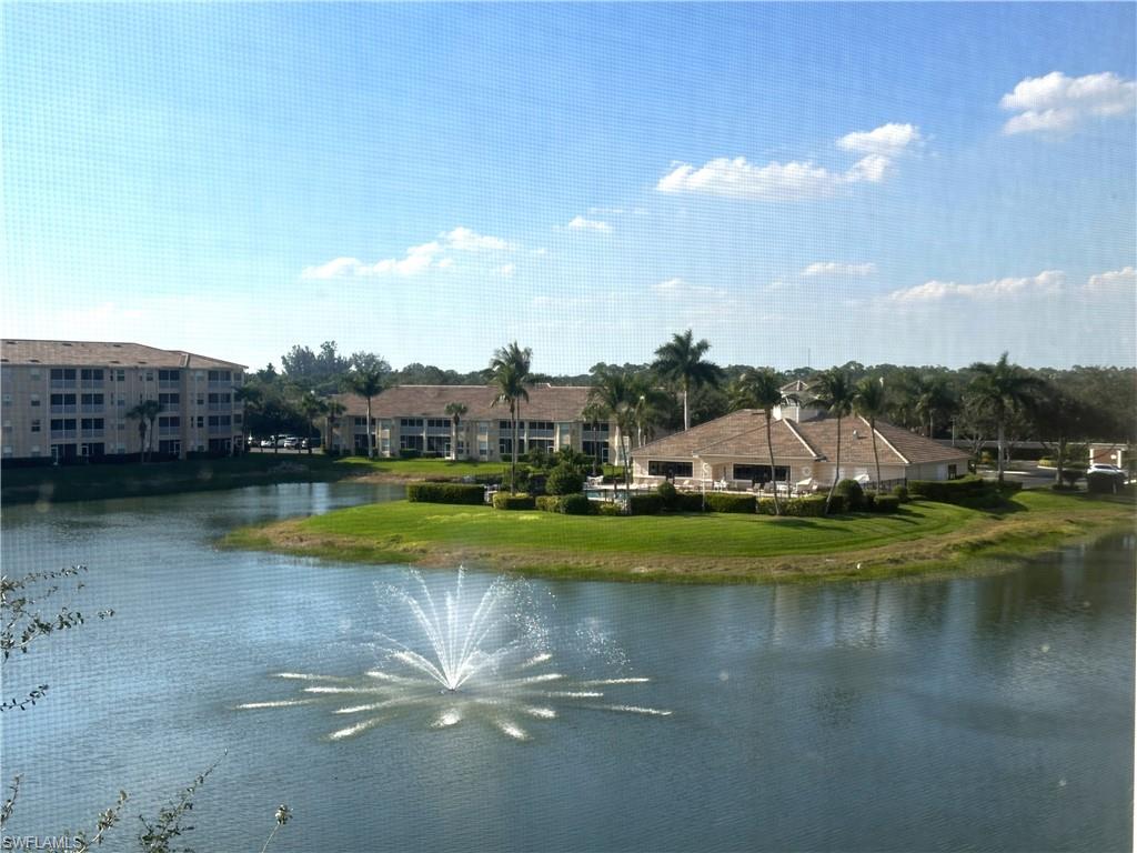 8570 Kingbird Loop, Unit 542 Estero, FL 33967 - Photo 31 of 43 a view of a house with a yard and a pond