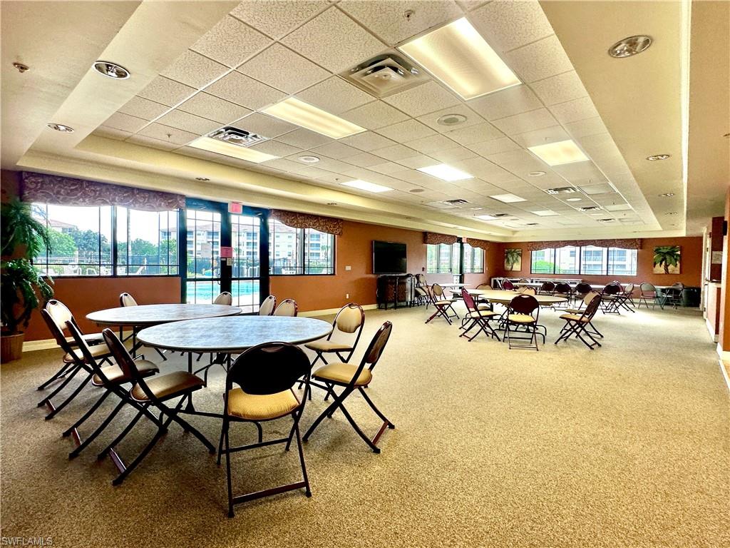 8570 Kingbird Loop, Unit 542 Estero, FL 33967 - Photo 38 of 43 a view of a dining room with furniture and a potted plant