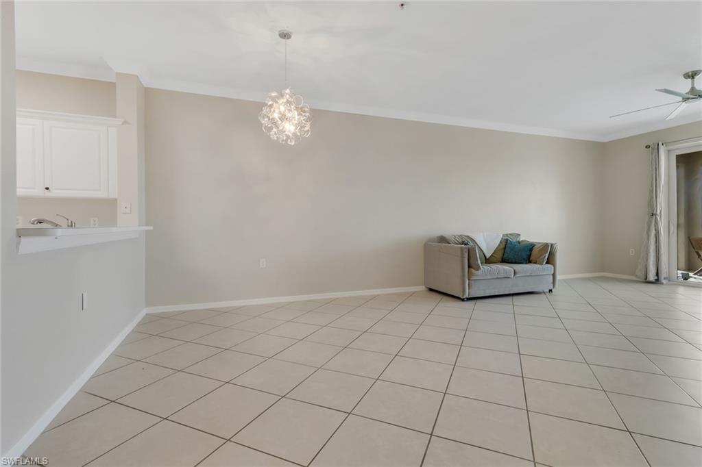 8570 Kingbird Loop, Unit 542 Estero, FL 33967 - Photo 6 of 43 a view of an empty room and chandelier fan