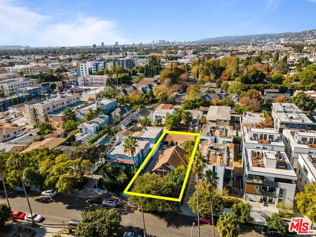 an aerial view of residential building and parking space