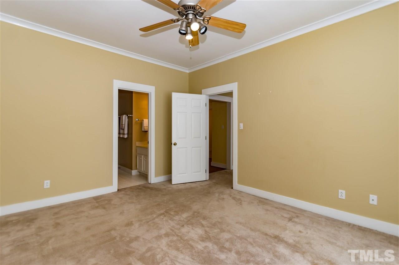 6038 Sentinel Drive Raleigh, NC 27609 - Photo 12 of 24 an empty room with closet and a chandelier fan