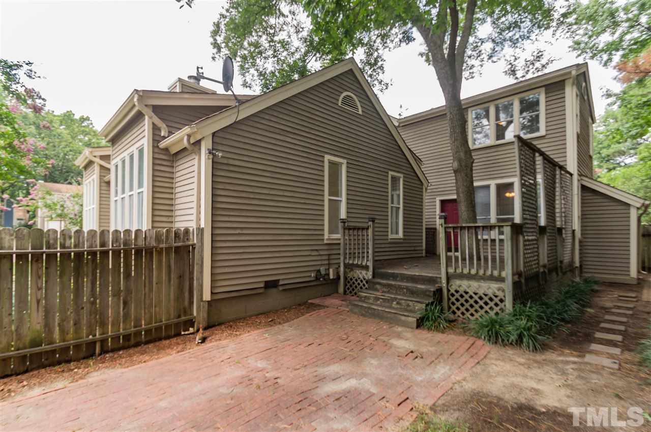 6038 Sentinel Drive Raleigh, NC 27609 - Photo 22 of 24 a front view of a house with a yard