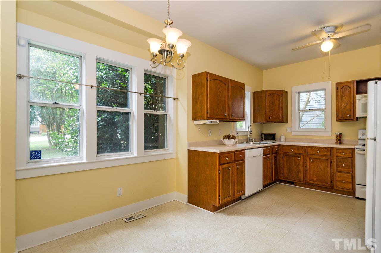 6038 Sentinel Drive Raleigh, NC 27609 - Photo 6 of 24 a large kitchen with a window