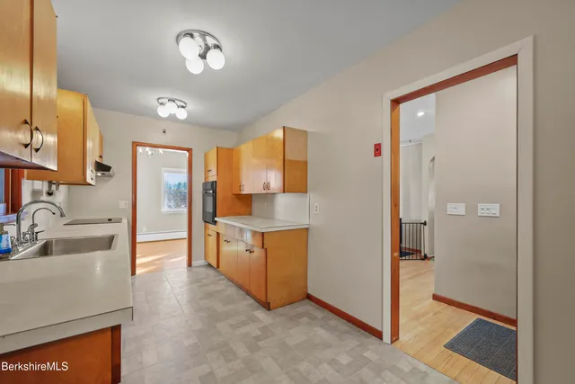 a bathroom with a sink a mirror and a shower