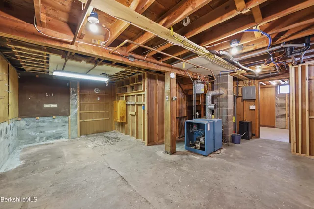 a view of a hallway with wooden walls