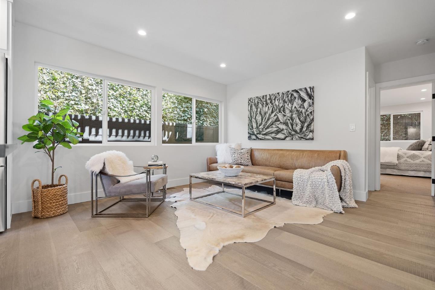 311 Keith Avenue Pacifica, CA 94044 - Photo 11 of 40 a living room with furniture and a potted plant