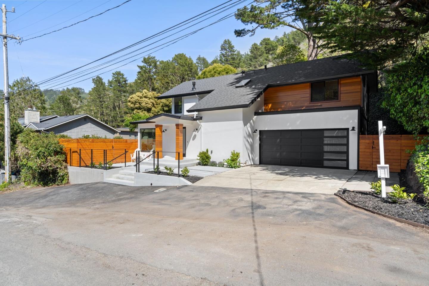 311 Keith Avenue Pacifica, CA 94044 - Photo 2 of 40 a front view of a house with a yard and garage
