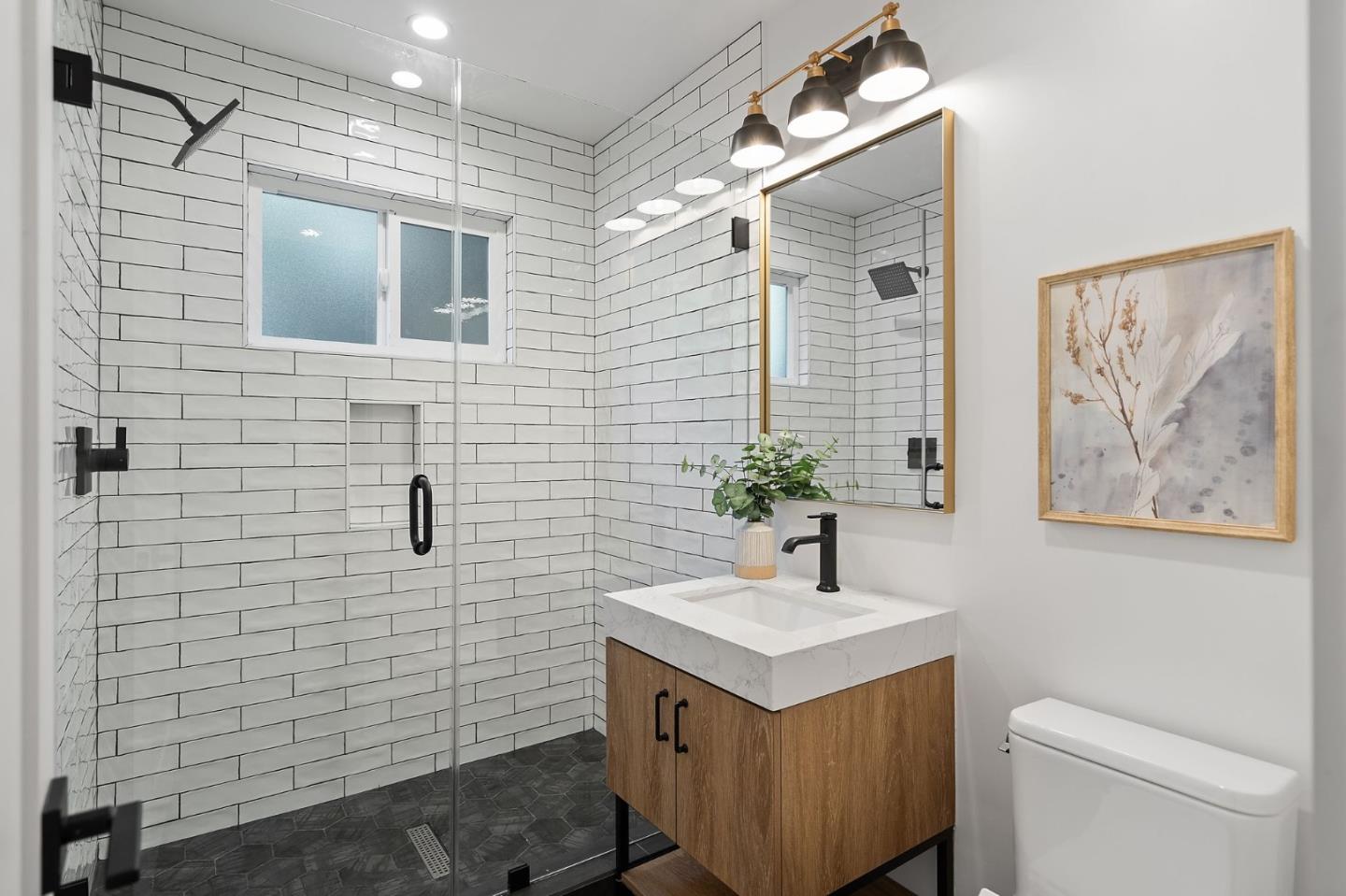 311 Keith Avenue Pacifica, CA 94044 - Photo 27 of 40 a bathroom with a sink a toilet and shower