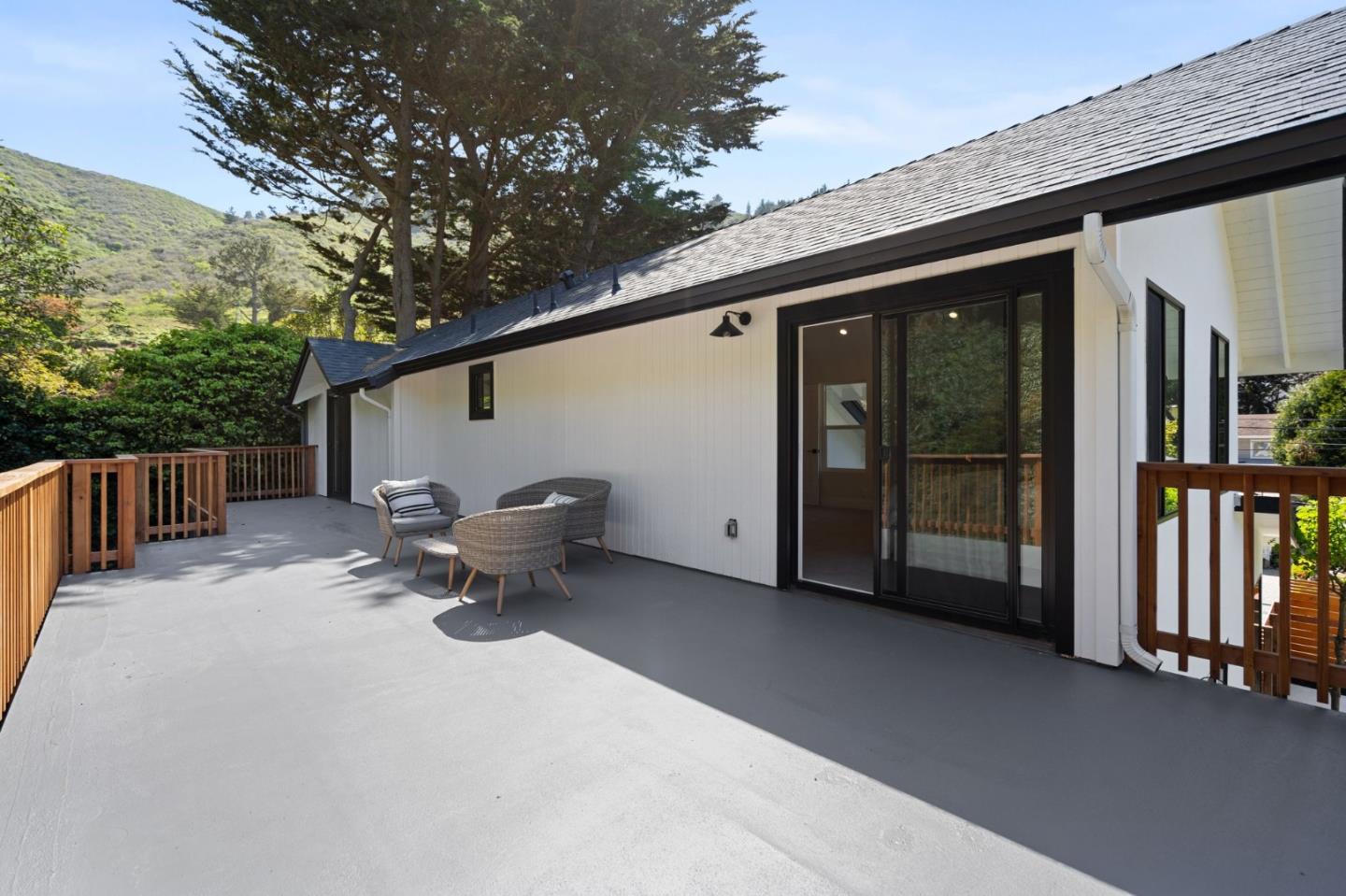 311 Keith Avenue Pacifica, CA 94044 - Photo 29 of 40 a backyard of a house with barbeque oven table and chairs