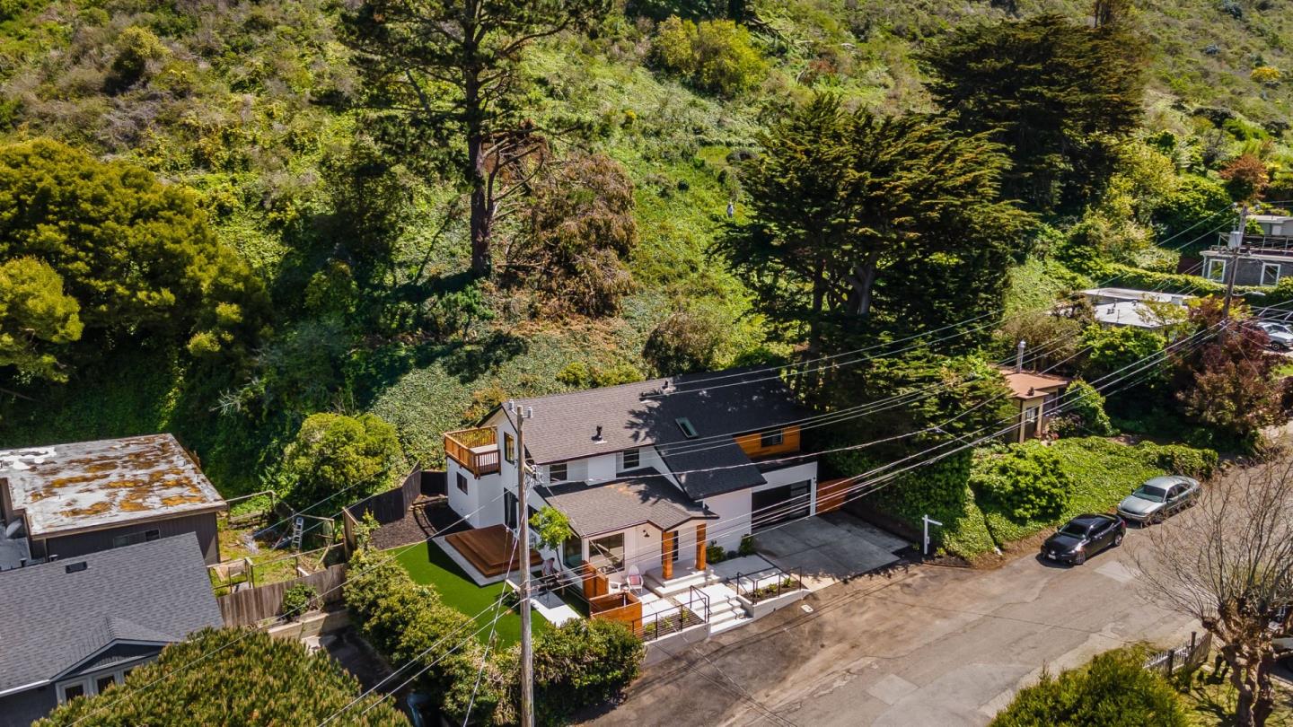 311 Keith Avenue Pacifica, CA 94044 - Photo 35 of 40 a backyard of a house with outdoor seating