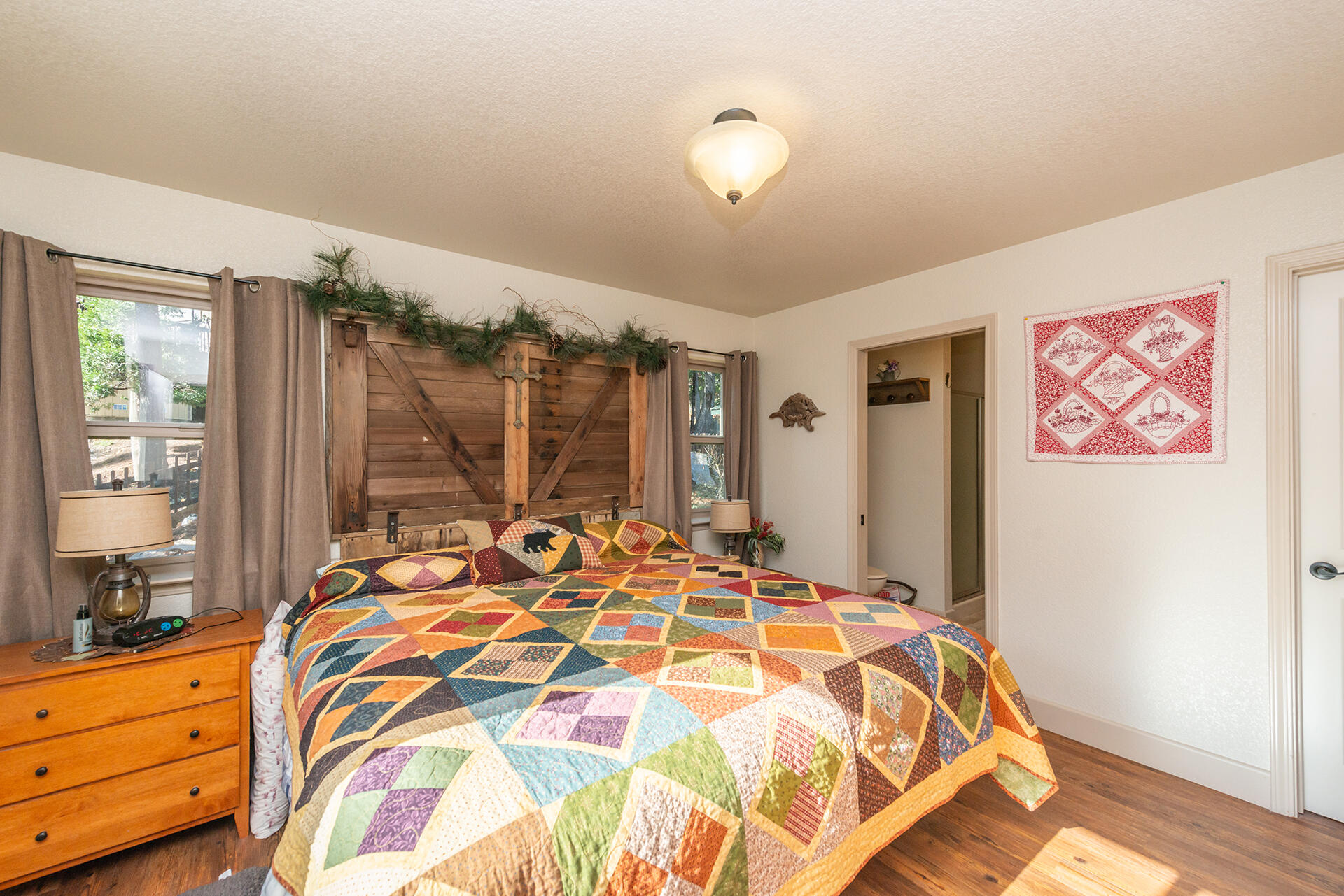 851 Mountain Aire Road Trinity Center, CA 96091 - Photo 17 of 54 a bed sitting in a bedroom next to a window
