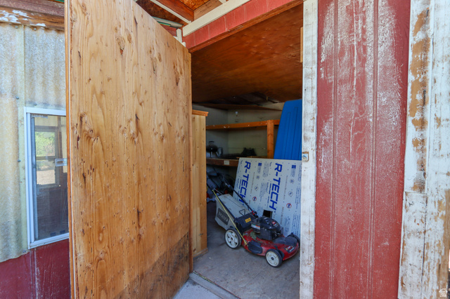 270 East 100 North Monroe, UT 84754 - Photo 52 of 65 Interior storage area featuring exposed wood framing, an open doorway, and a small window with a white frame