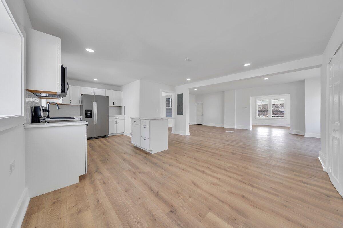 3808 Oldtown Road Shawsville, VA 24162 - Photo 11 of 50 a view of kitchen with kitchen island stainless steel appliances refrigerator stove microwave and cabinets