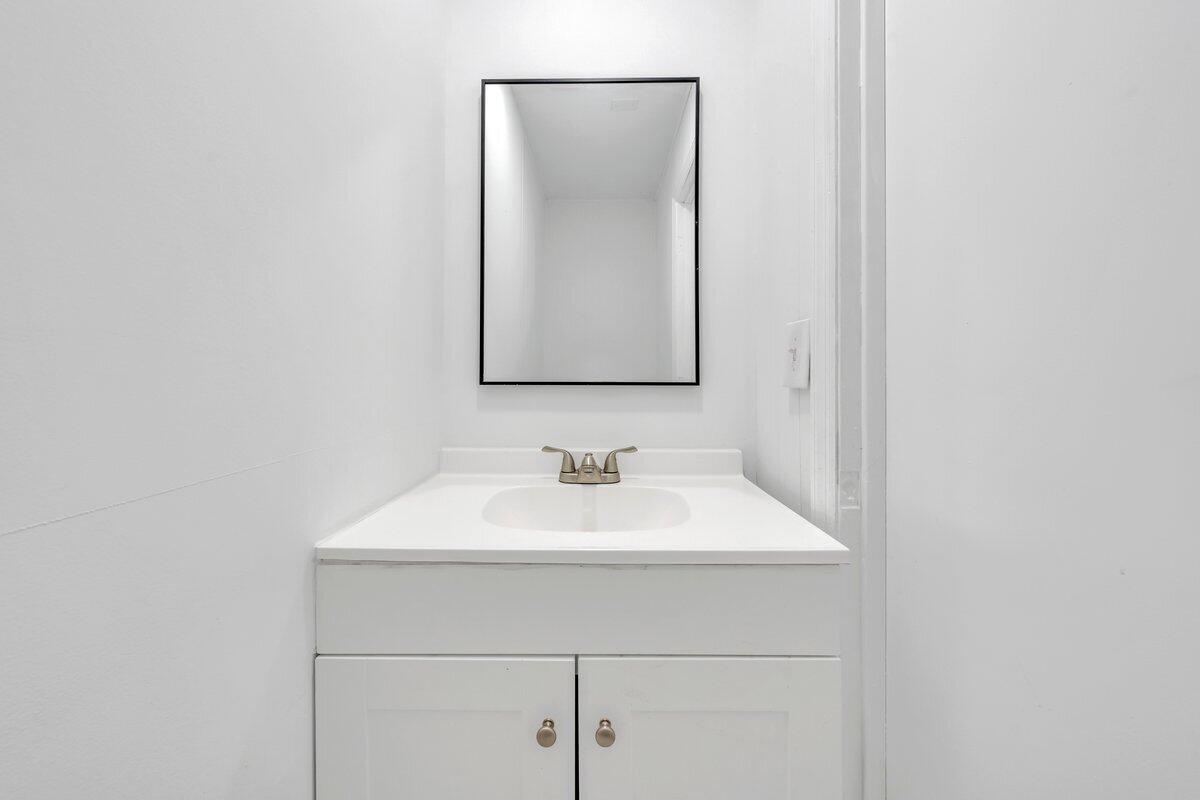 3808 Oldtown Road Shawsville, VA 24162 - Photo 17 of 50 a bathroom with a sink and a mirror