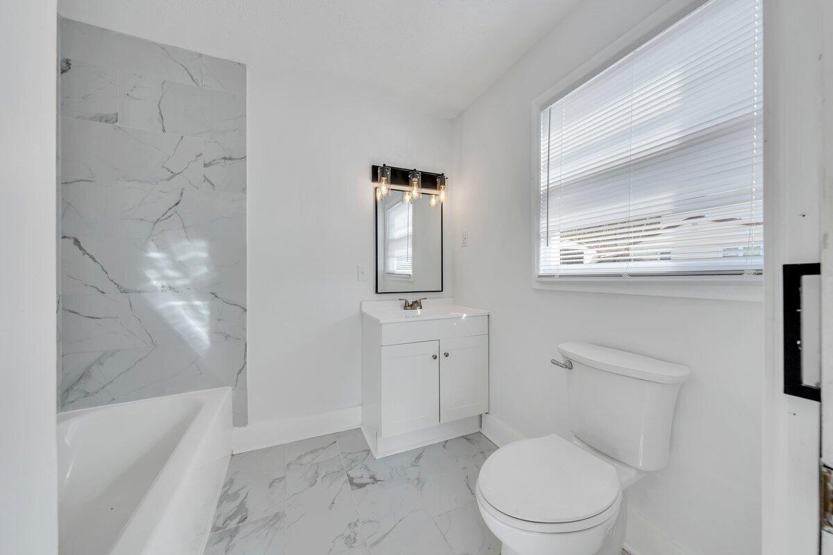 3808 Oldtown Road Shawsville, VA 24162 - Photo 23 of 50 a bathroom with a toilet a sink and bathtub