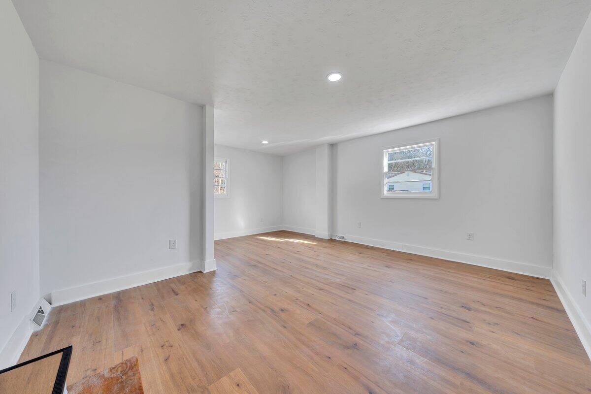 3808 Oldtown Road Shawsville, VA 24162 - Photo 26 of 50 a view of an empty room with wooden floor and a window