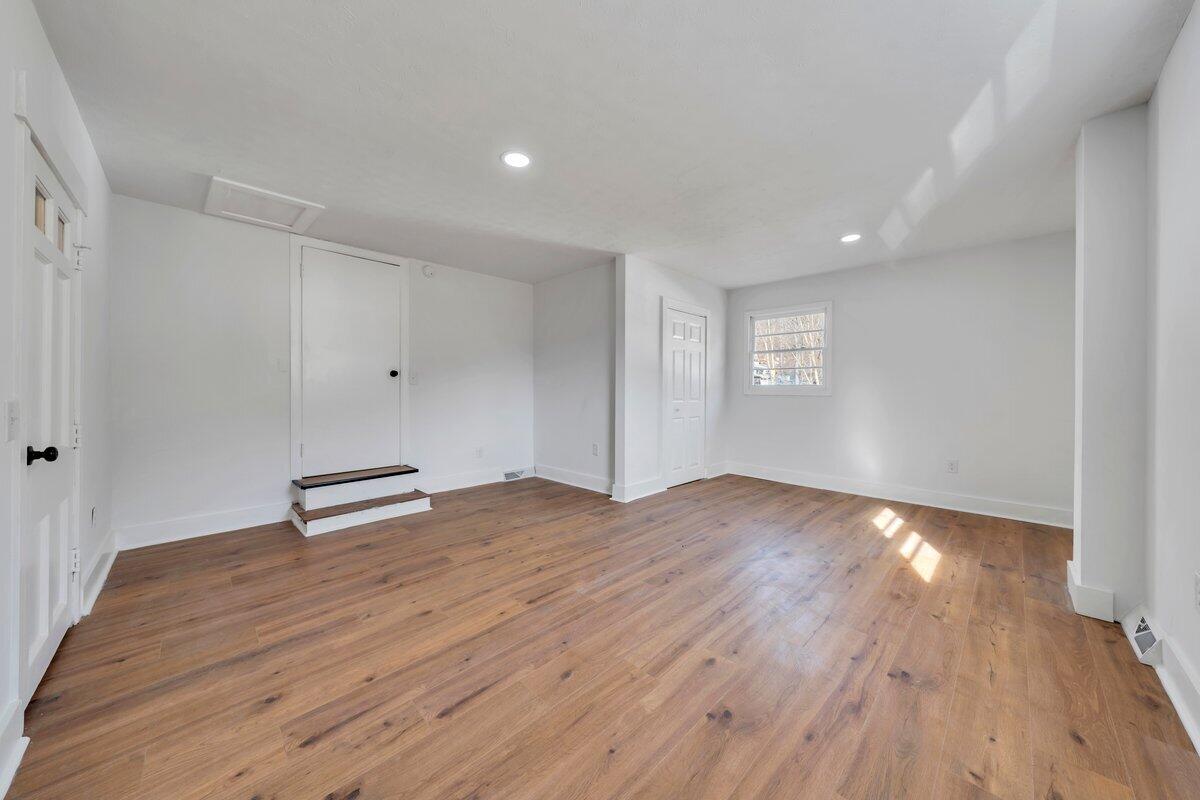 3808 Oldtown Road Shawsville, VA 24162 - Photo 27 of 50 a view of empty room with wooden floor and fan