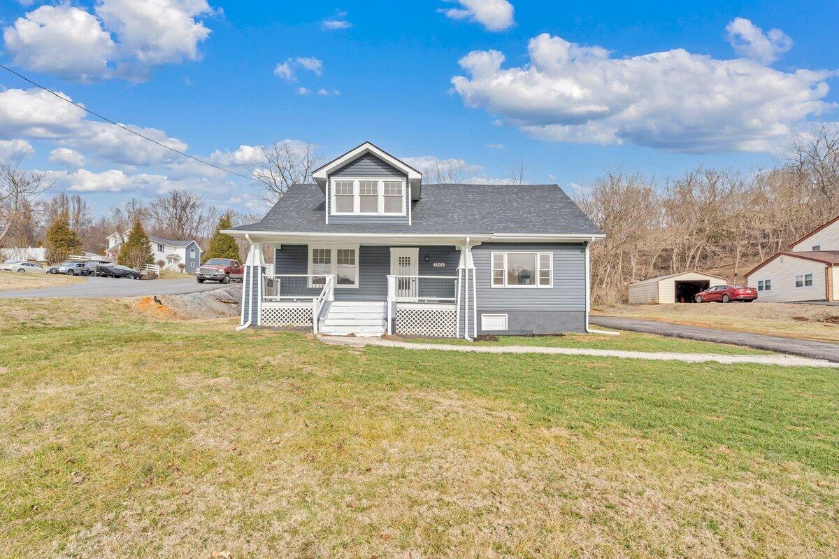 3808 Oldtown Road Shawsville, VA 24162 - Photo 44 of 50 a front view of a house with a garden and lake view