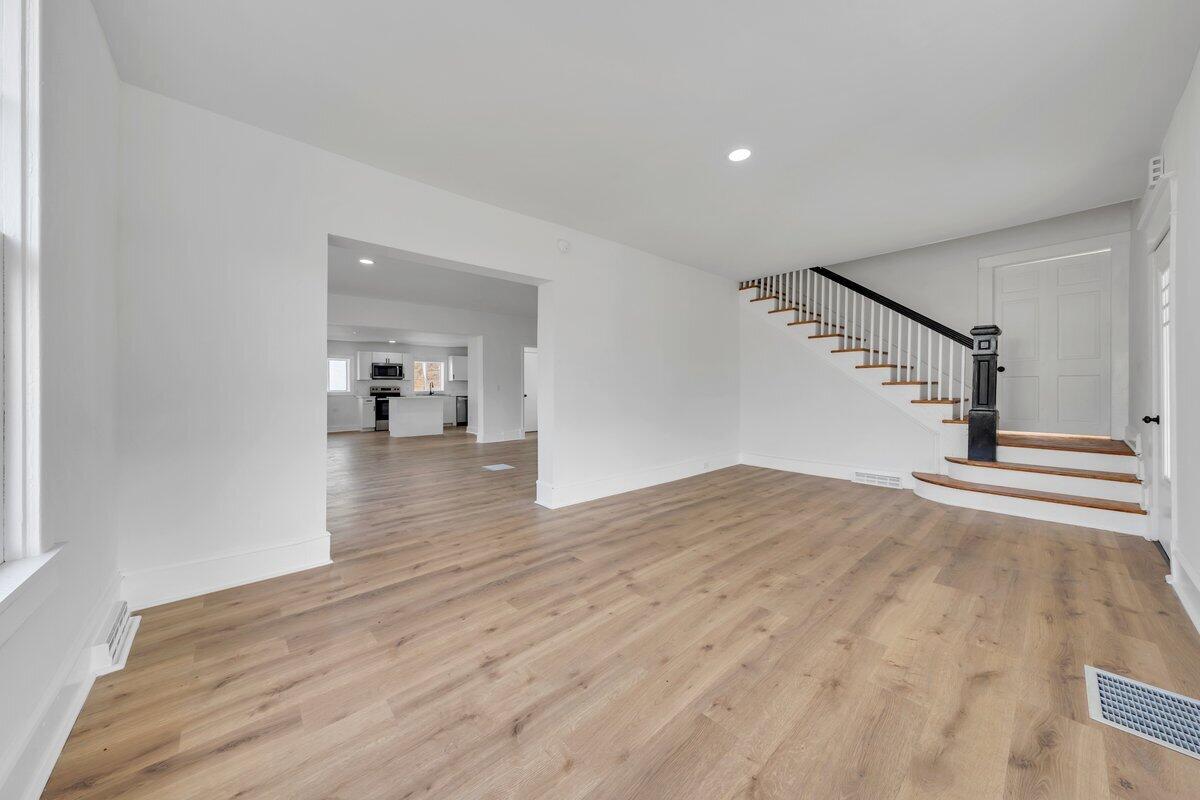 3808 Oldtown Road Shawsville, VA 24162 - Photo 5 of 50 a view of empty room with wooden floor and stairs