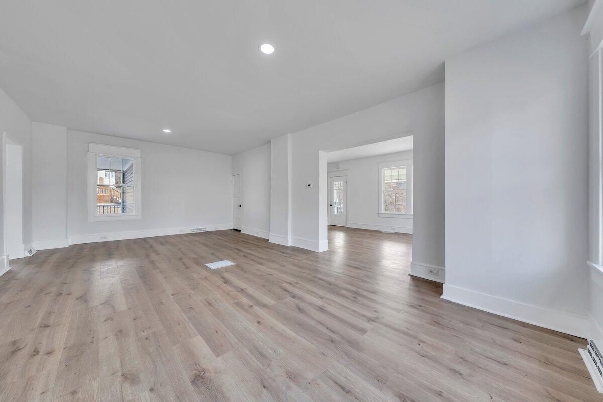 3808 Oldtown Road Shawsville, VA 24162 - Photo 8 of 50 an empty room with wooden floor and windows