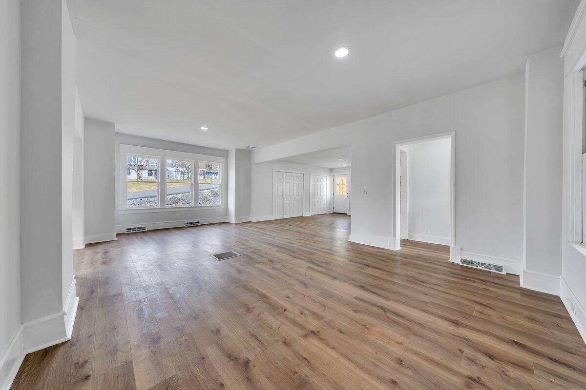 3808 Oldtown Road Shawsville, VA 24162 - Photo 9 of 50 a view of an empty room with window and wooden floor