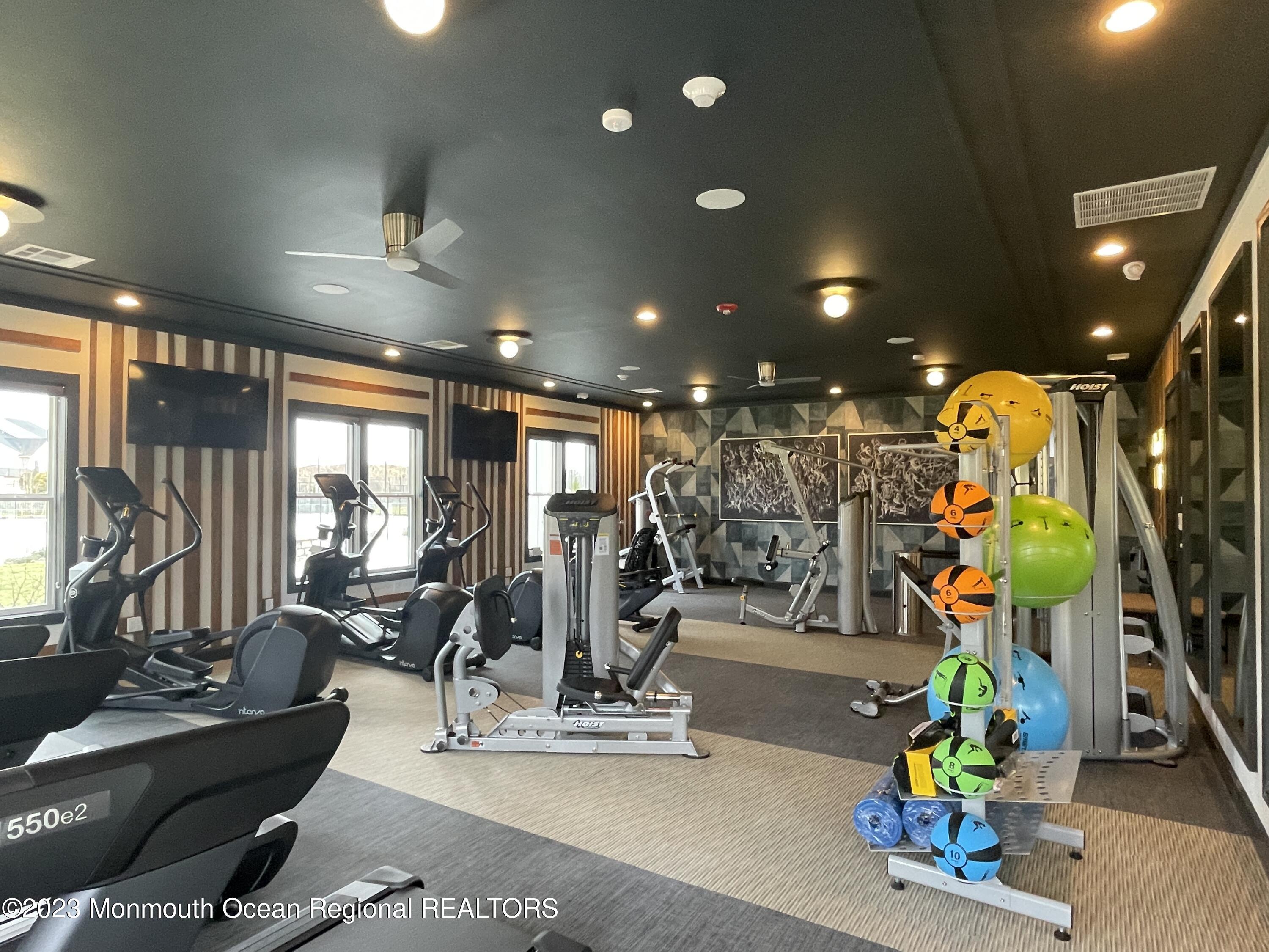 105 Sofia Drive Manalapan, NJ 07726 - Photo 8 of 12 a view of a room with gym equipment