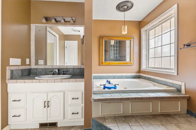 a bathroom with a sink and a mirror