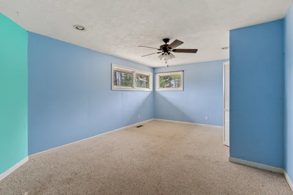 a view of a big room with carpet