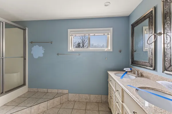 a bathroom with a sink a vanity and a mirror