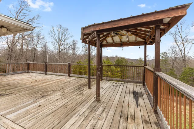a view of wooden deck with a ocean view