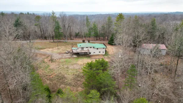 a view of a backyard of the house