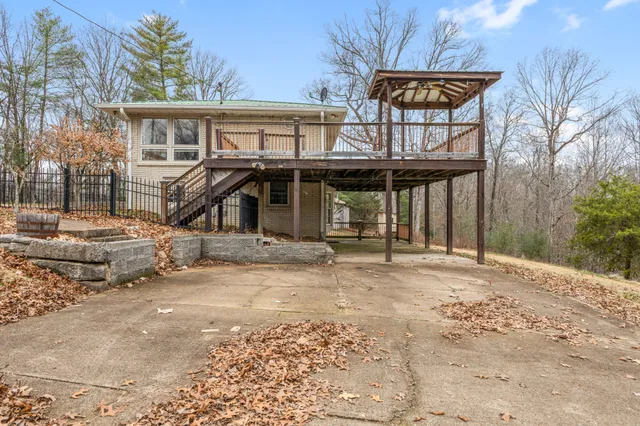 a view of a chairs and table in the patio