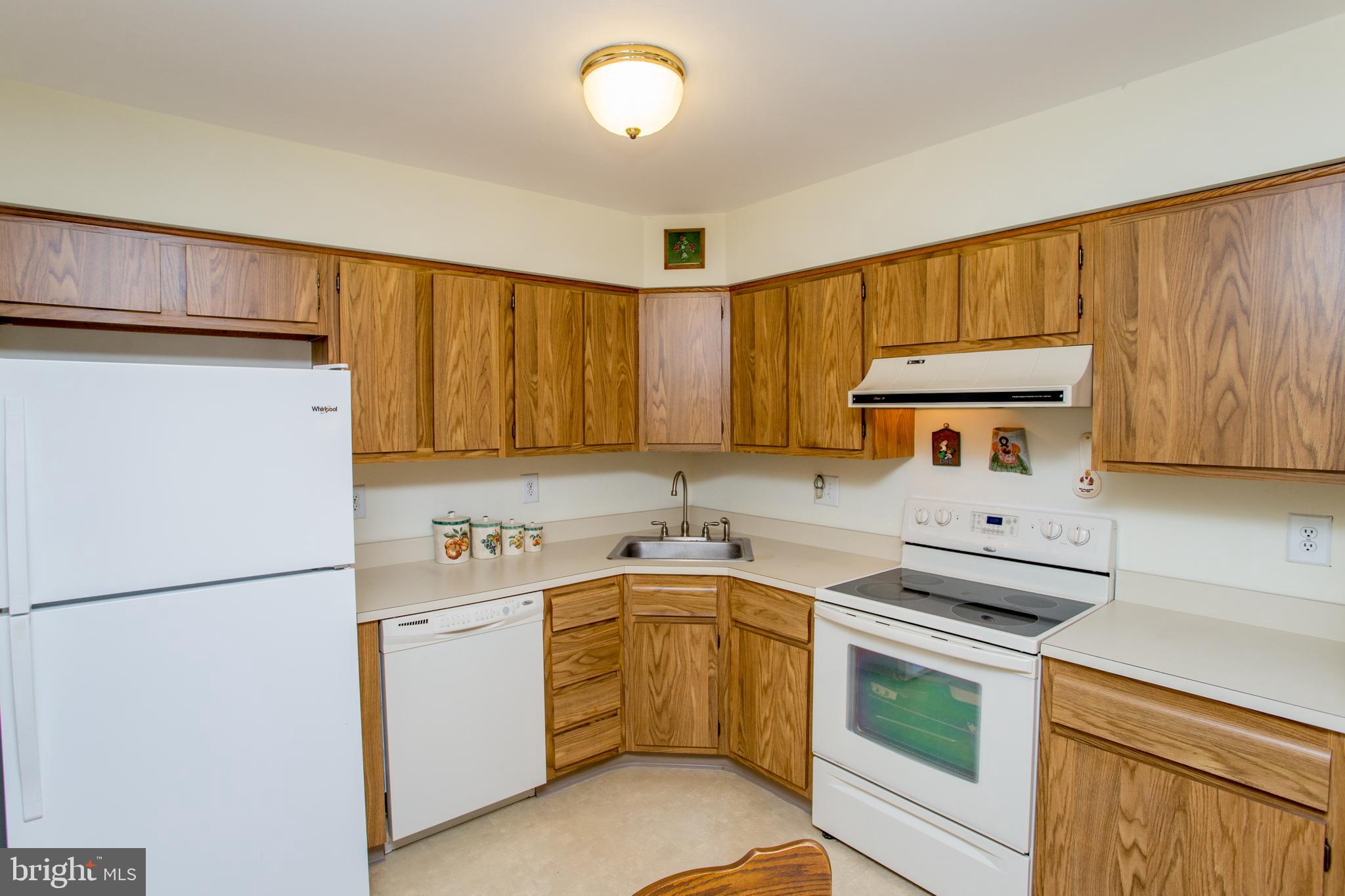 60 B Sumac Court Mount Laurel, NJ 08054 - Photo 14 of 42 a kitchen with a sink stove and refrigerator