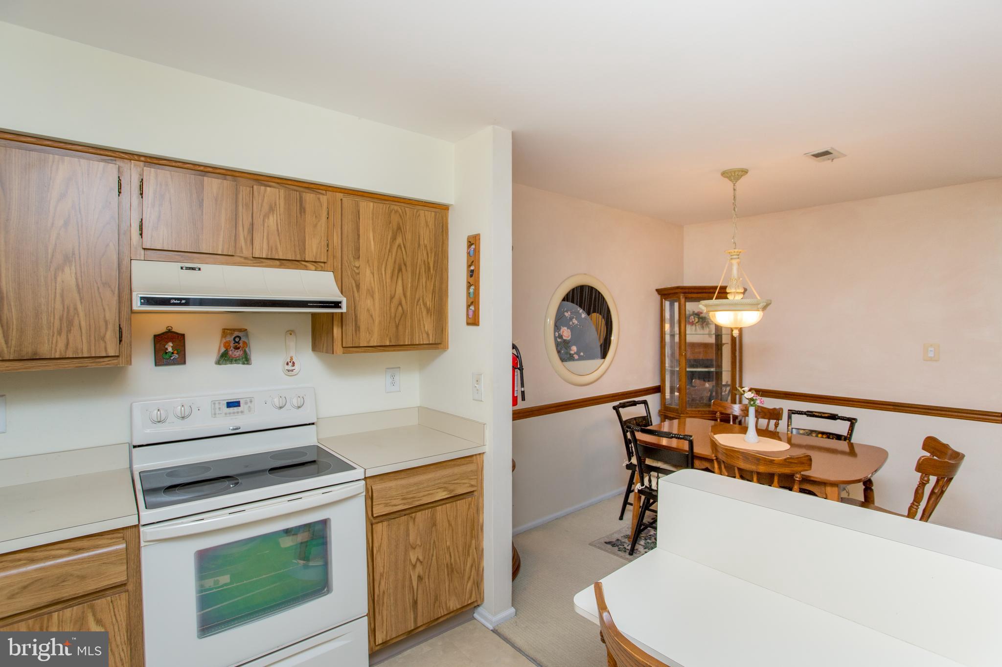 60 B Sumac Court Mount Laurel, NJ 08054 - Photo 15 of 42 a kitchen with a stove and a white refrigerator