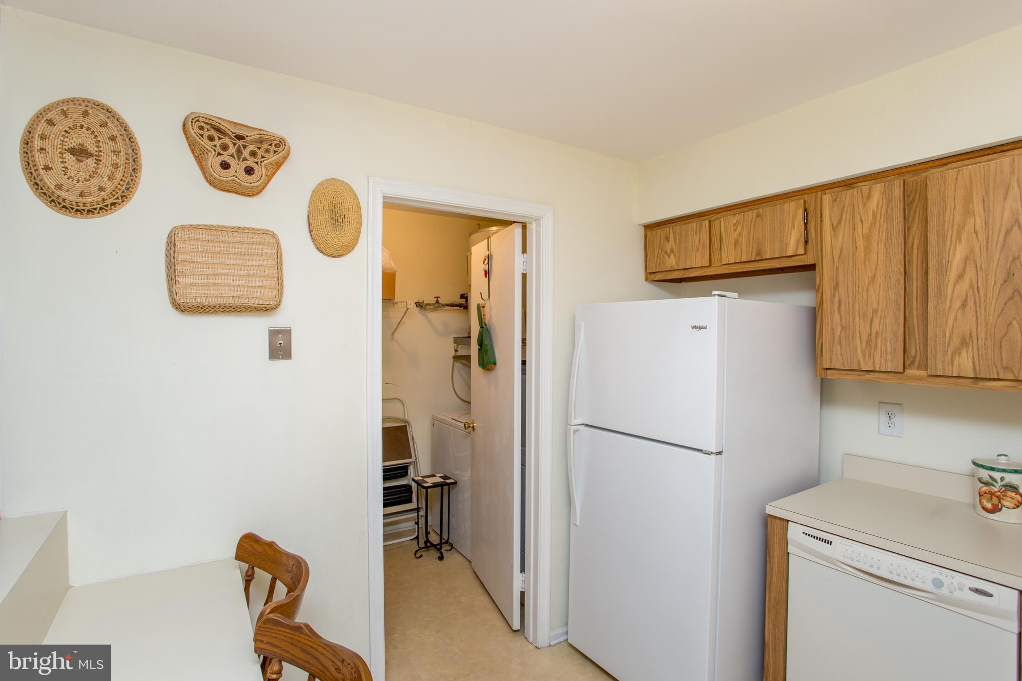60 B Sumac Court Mount Laurel, NJ 08054 - Photo 16 of 42 a white refrigerator freezer sitting inside of a kitchen