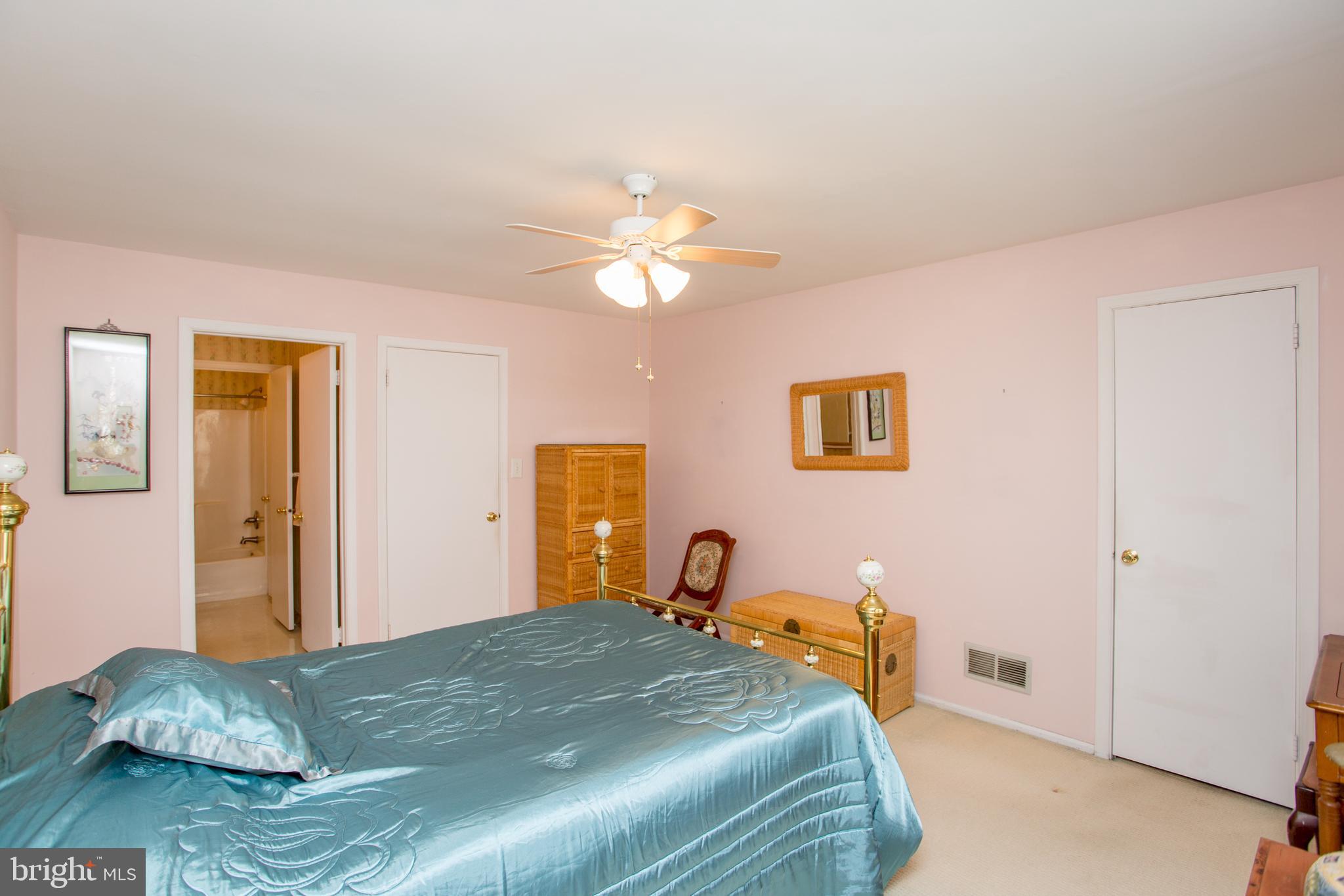 60 B Sumac Court Mount Laurel, NJ 08054 - Photo 21 of 42 a bedroom with a bed and a chandelier