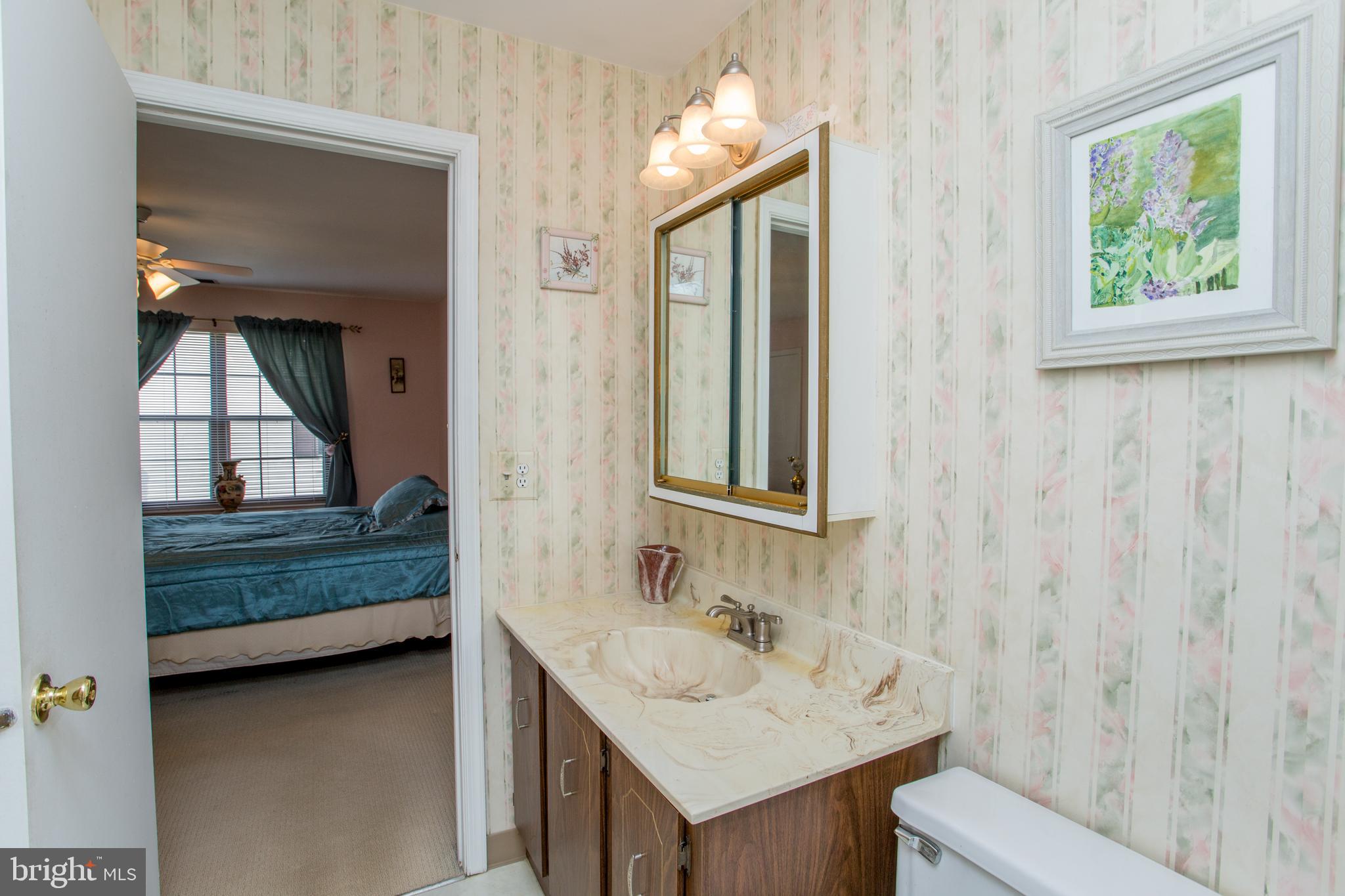 60 B Sumac Court Mount Laurel, NJ 08054 - Photo 23 of 42 a bathroom with a sink and a mirror
