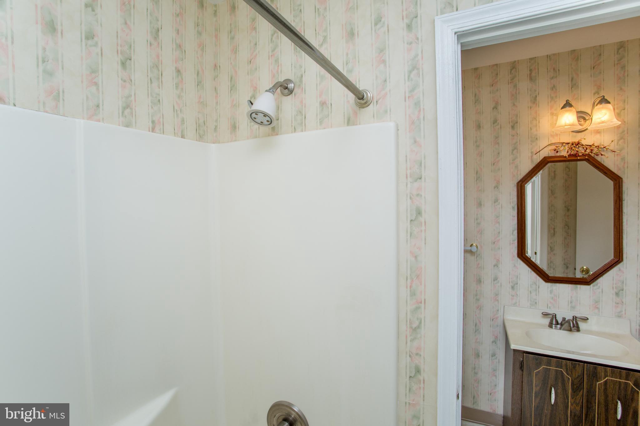 60 B Sumac Court Mount Laurel, NJ 08054 - Photo 24 of 42 a bathroom with a sink and a mirror