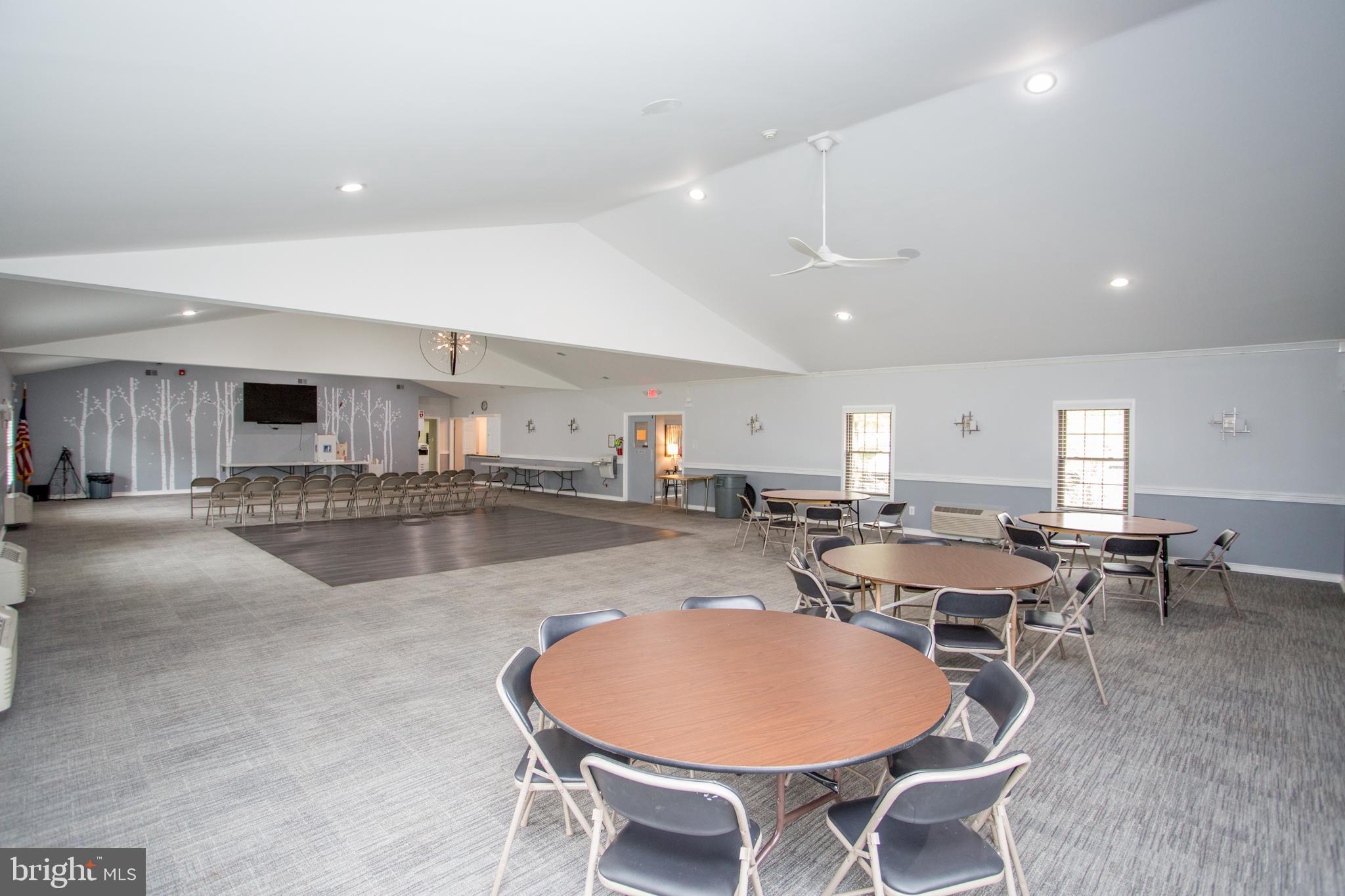 60 B Sumac Court Mount Laurel, NJ 08054 - Photo 32 of 42 a dining hall with stainless steel appliances a dining table and chairs with kitchen view