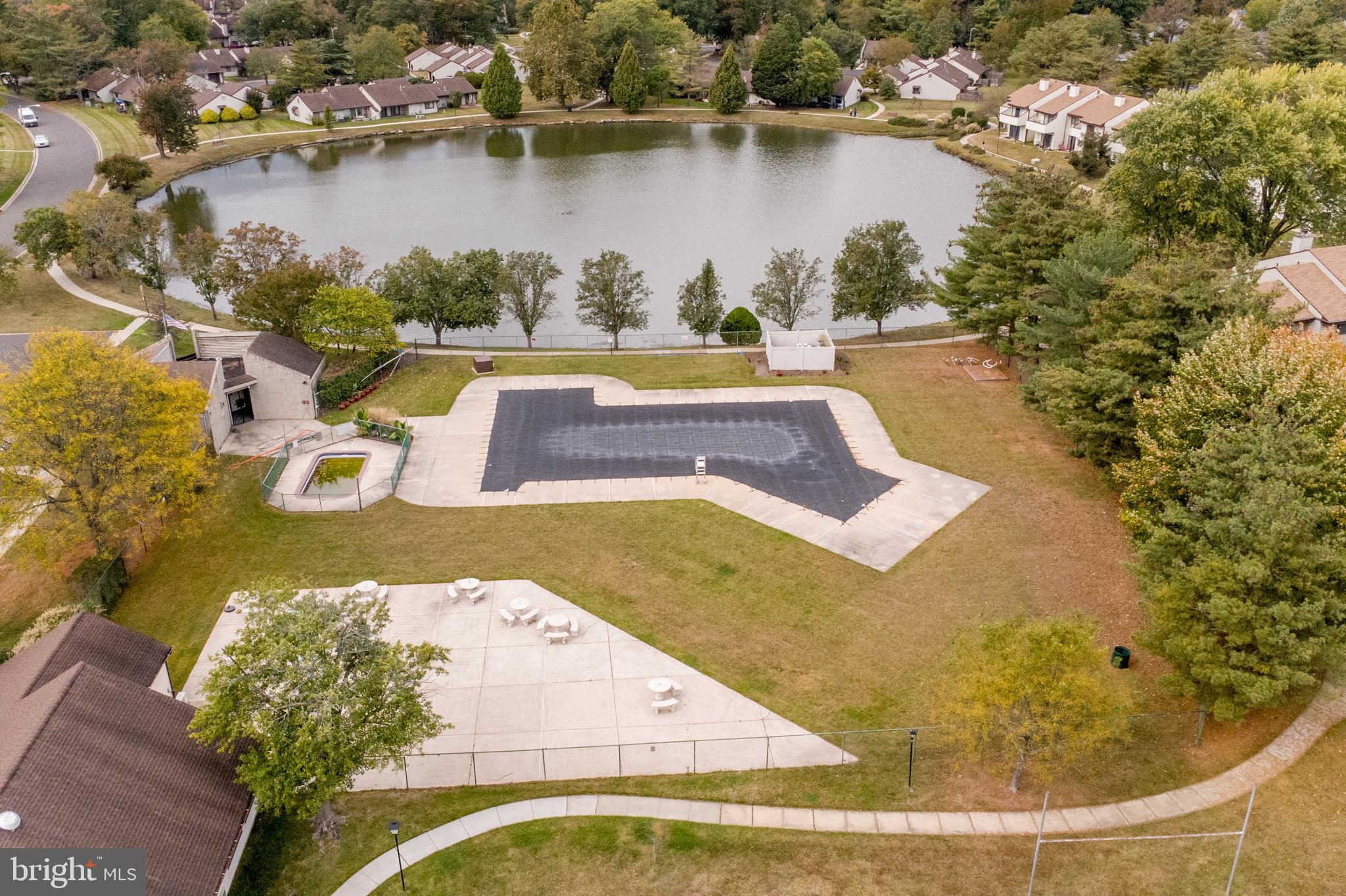 60 B Sumac Court Mount Laurel, NJ 08054 - Photo 36 of 42 a view of a swimming pool with a lake view